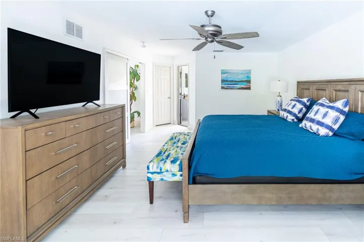Bedroom featuring a ceiling fan and light wood-type flooring