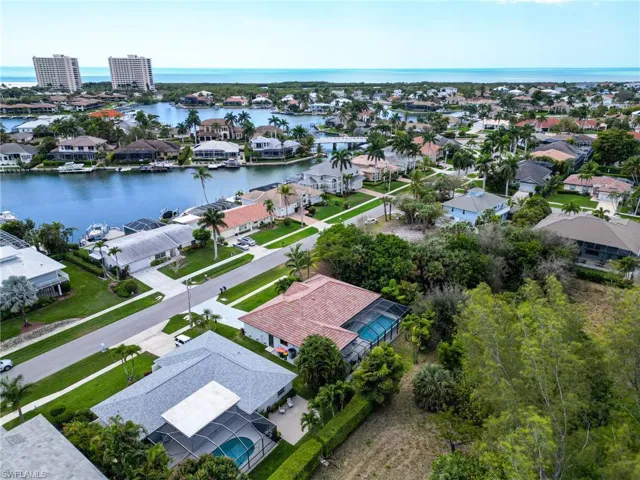 Aerial view of residential area with a large body of water