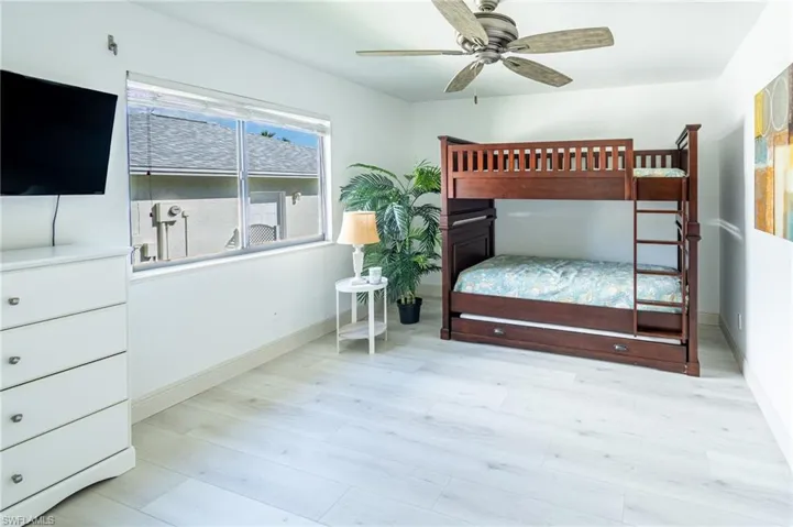 Bedroom with light wood-type flooring and ceiling fan