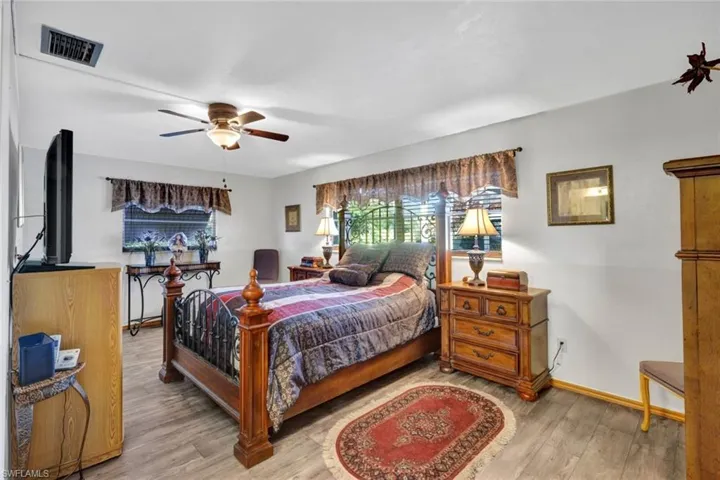 The Primary Bedroom is large with vinyl flooring and walk in closet