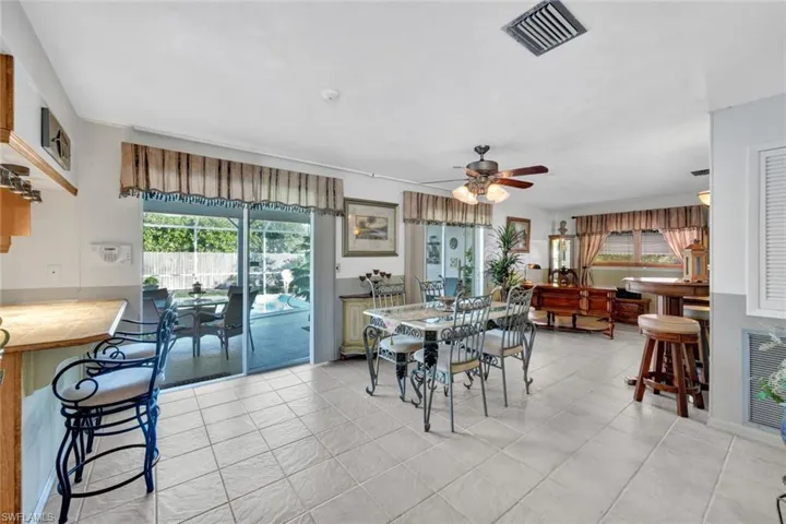 The Dining area is open plan with views over the pool, Kitchen and Living Room