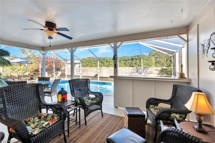 The pool deck has a delightful covered seated area