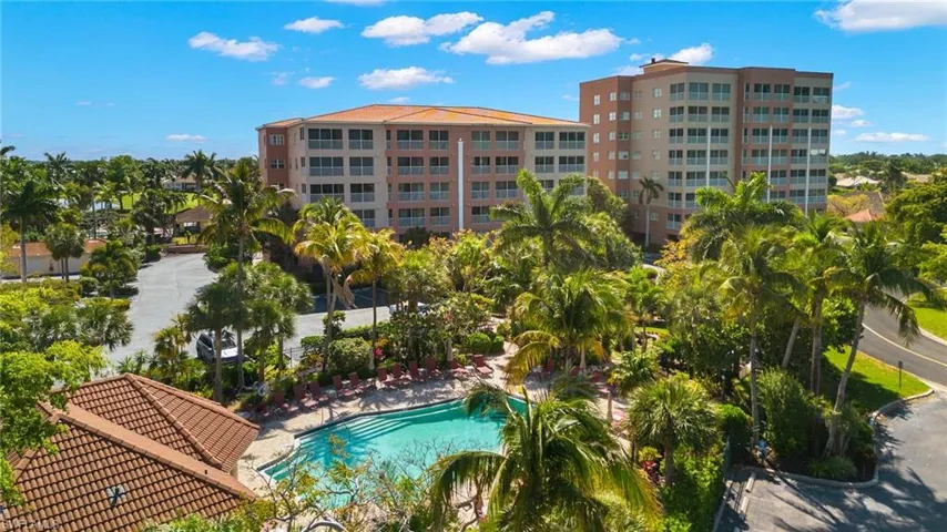 Fantastic pool deck with plenty of seating, 2 grills and a large hot tub / spa.And the butterfly garden