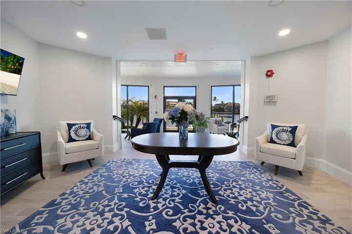 Dining room with recessed lighting and light wood-type flooring