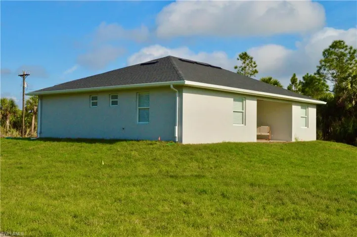 View of home's exterior featuring a yard