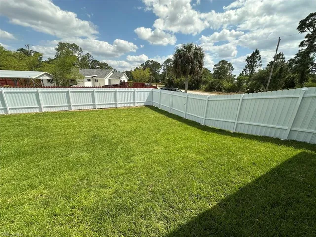 View of yard featuring a fenced backyard
