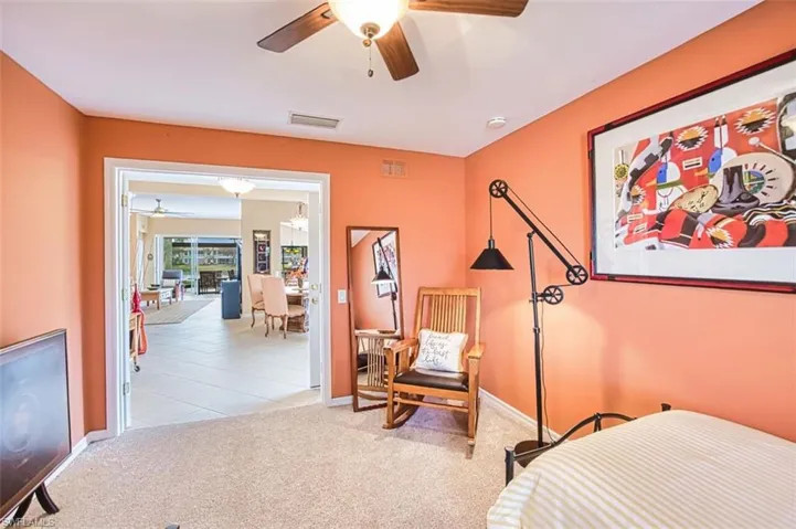 Bonus room featuring light carpet and ceiling fan