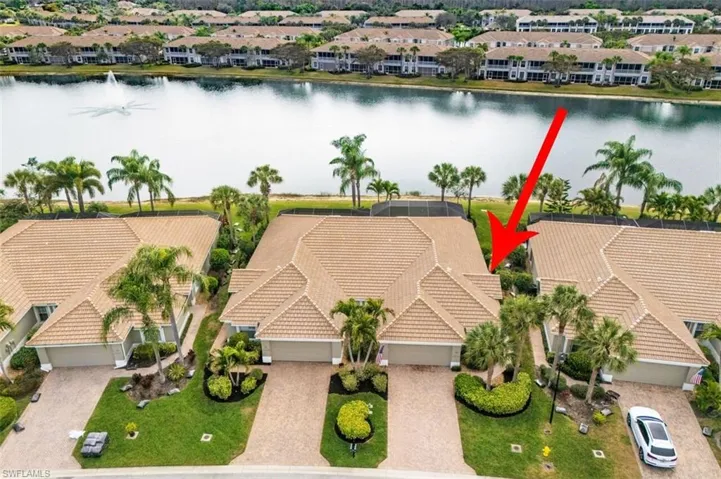Aerial perspective of suburban area with a nearby body of water