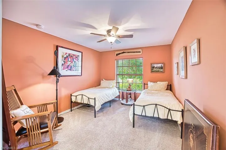 Bonus room featuring light colored carpet and ceiling fan
