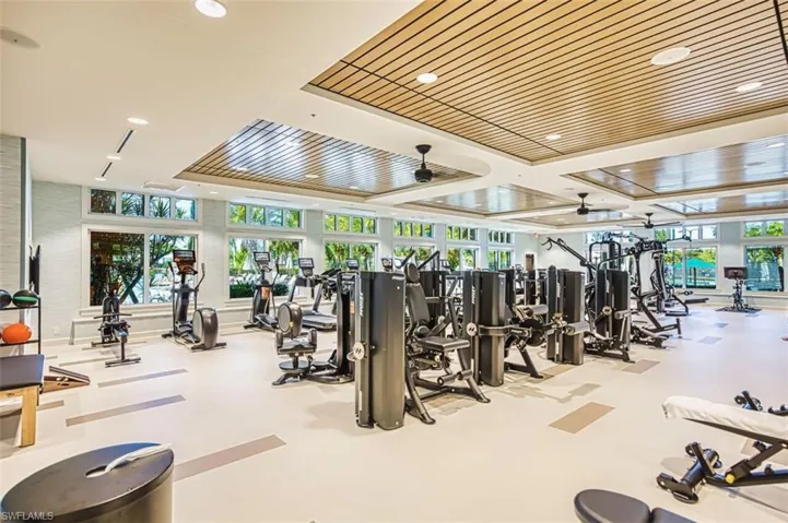 Gym with ceiling fan and recessed lighting