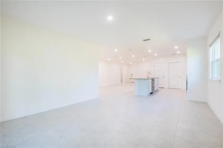 Unfurnished living room with recessed lighting