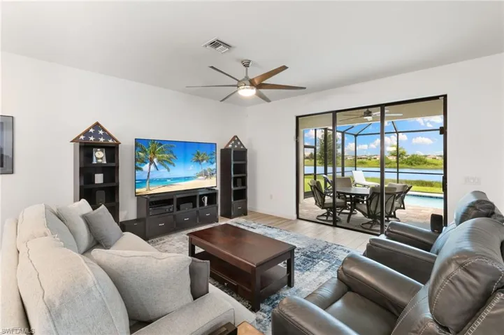 Living room featuring a sunroom and wood finished floors