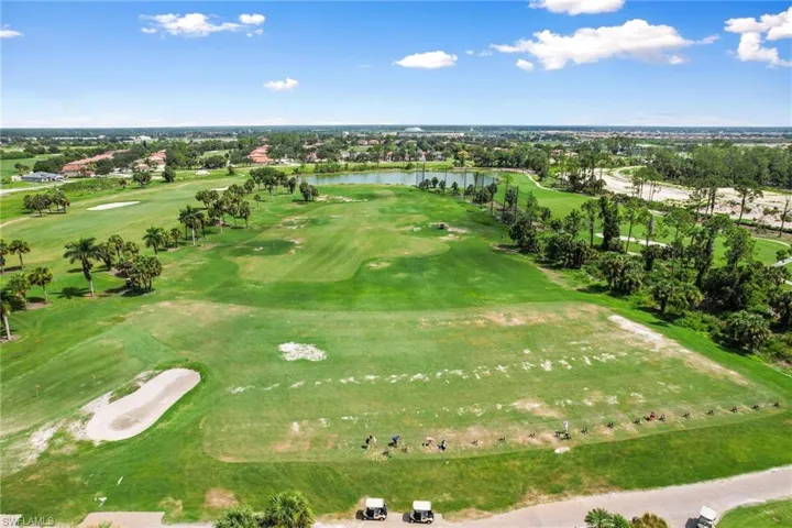 Aerial view of a nearby body of water and a golf course