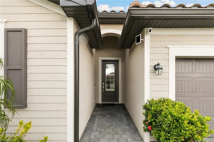 Property entrance with stucco siding