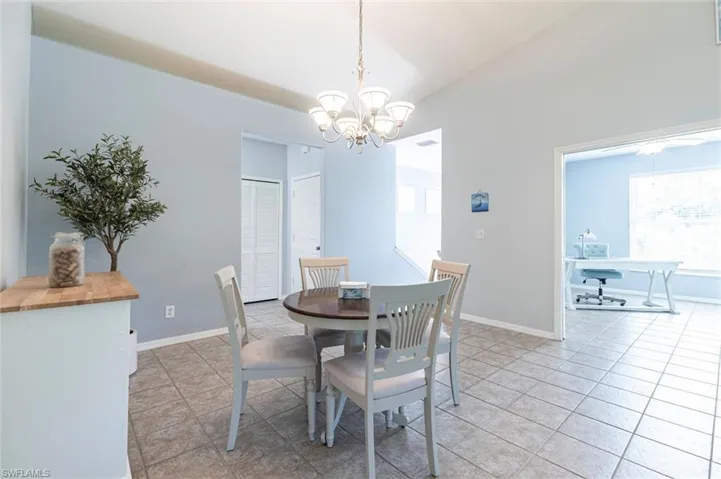 Dining area featuring a chandelier and light tile patterned floors