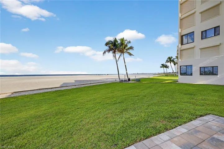 View of green lawn with a water view