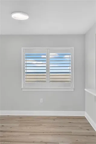 Spare room with light plank tile floors