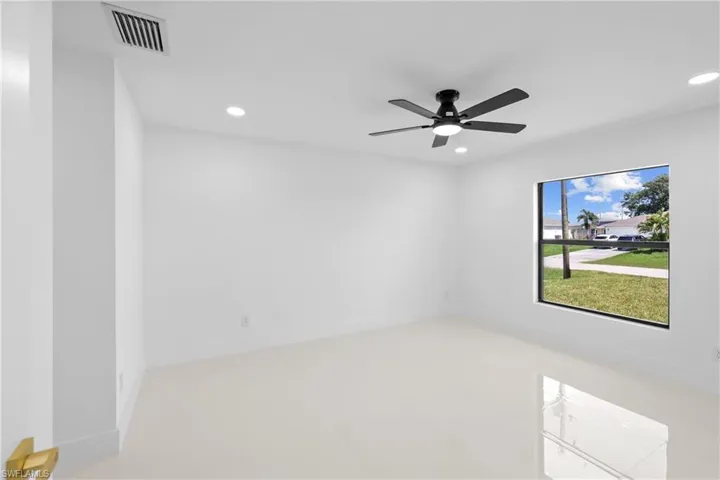 Unfurnished room with recessed lighting and a ceiling fan