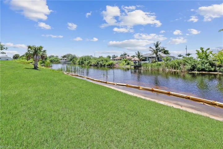View of grassy yard featuring a water view
