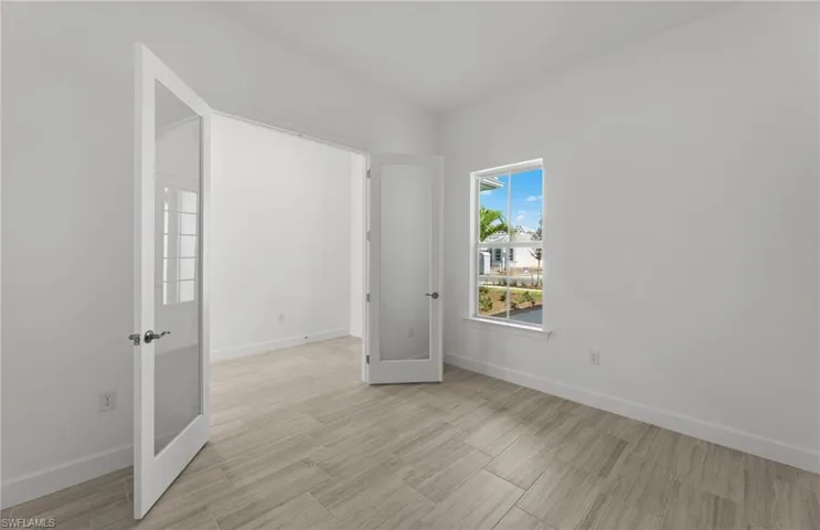 Spare room with french doors