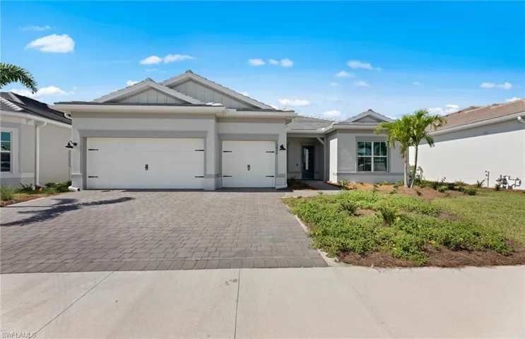 Ranch-style house featuring a garage