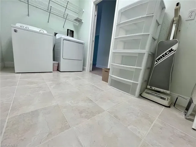 Clothes washing area featuring independent washer and dryer