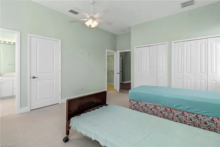 Master Bedroom #1, canal side, bathroom, multiple closets, and ceiling fan