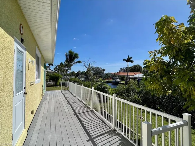 Composite deck with a water view and a lawn