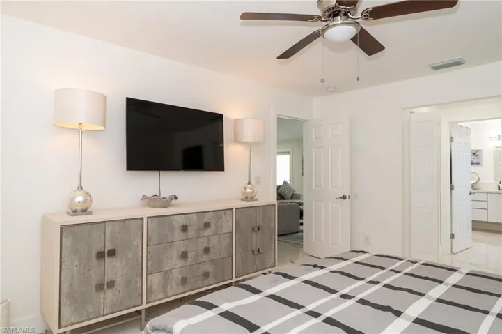 bedroom with ensuite bath and 2 walking closets.