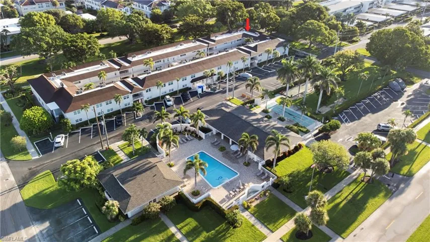 Aerial overview of property's location featuring a pool area