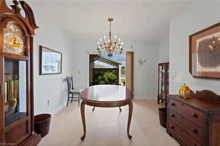 Bedroom with access to exterior, light hardwood / wood-style floors, and ceiling fan