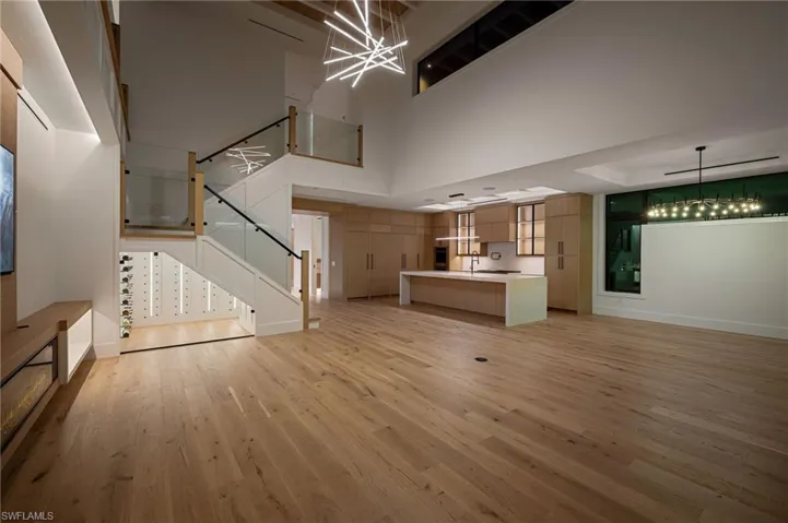 View 1 - Open living area designed for entertaining, enhanced with sleek low-voltage lighting throughout.