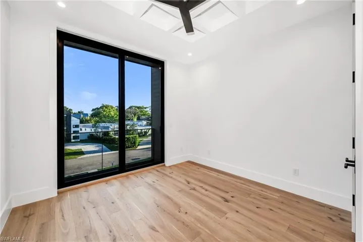 Guest Bedroom 2 with a private ensuite bath and balcony.