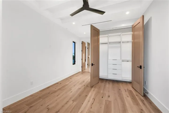 Guest Bedroom 1 - custom closet with low-voltage lighting.
