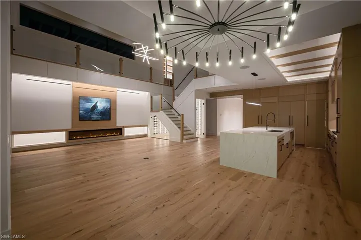 View 2 - Open living area designed for entertaining, enhanced with sleek low-voltage lighting throughout.