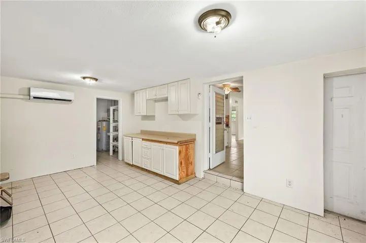 Bonus room or den with cabinetry