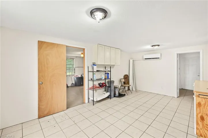 Bonus room or den with cabinetry
