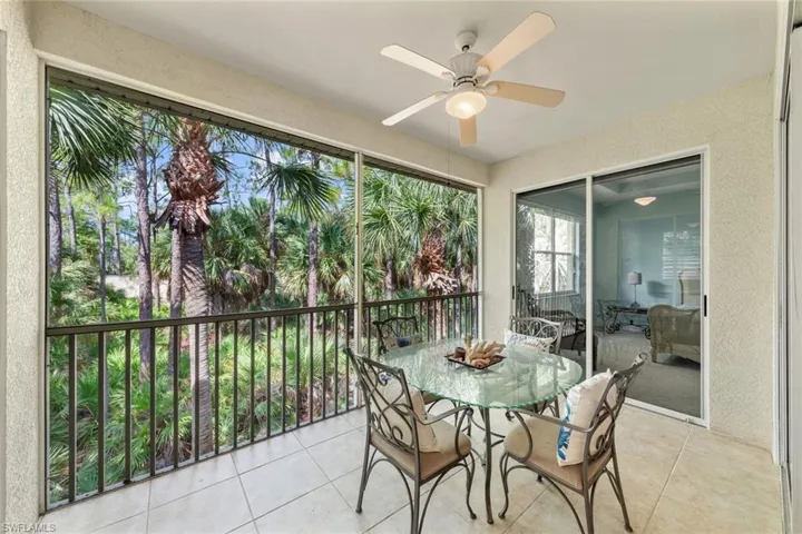 Sunroom / solarium with a healthy amount of sunlight and ceiling fan