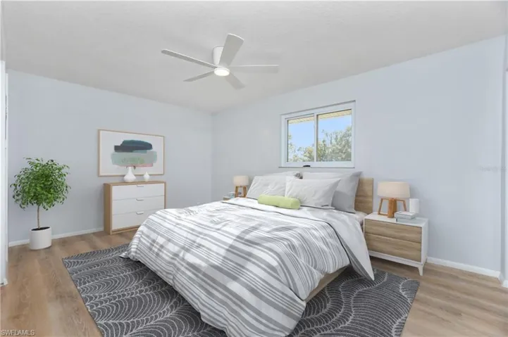 Bedroom featuring light wood-type flooring and ceiling fan