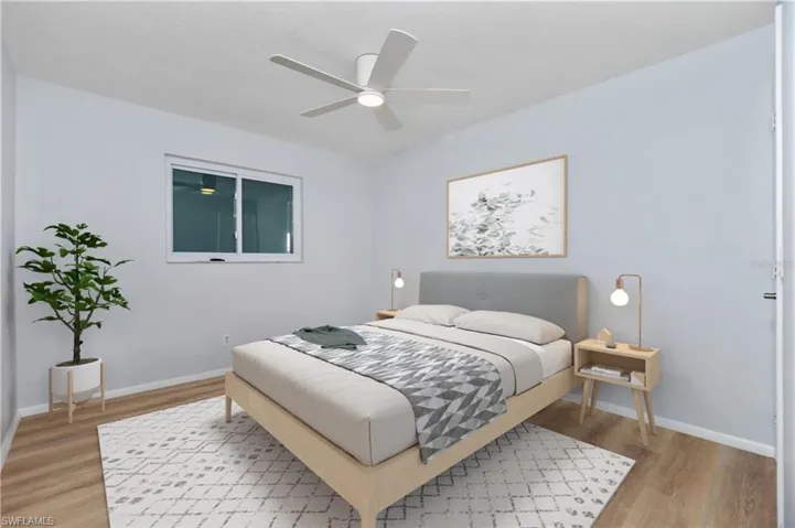 Bedroom with ceiling fan and wood-type flooring