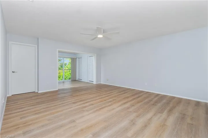 Empty room featuring ceiling fan and light hardwood / wood-style flooring