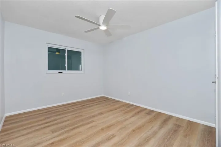 Unfurnished room featuring ceiling fan and light hardwood / wood-style floors