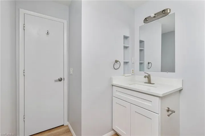 Bathroom featuring vanity and hardwood / wood-style flooring