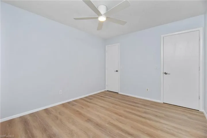 Spare room featuring light hardwood / wood-style flooring and ceiling fan