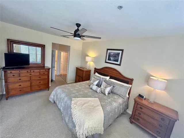 Bedroom featuring ceiling fan and light carpet