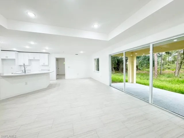 Unfurnished living room with sink
