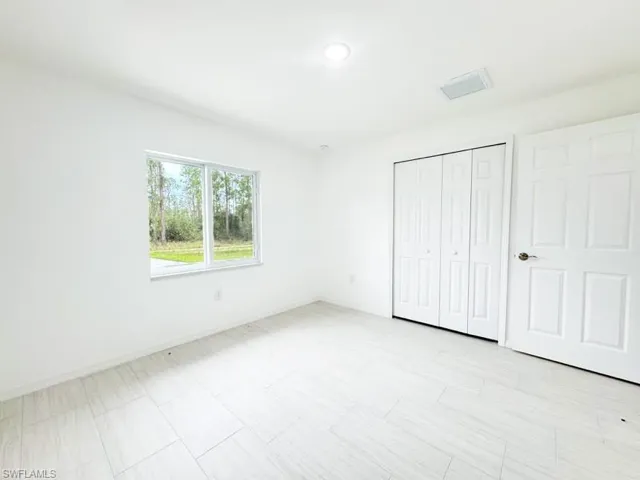Unfurnished bedroom featuring a closet