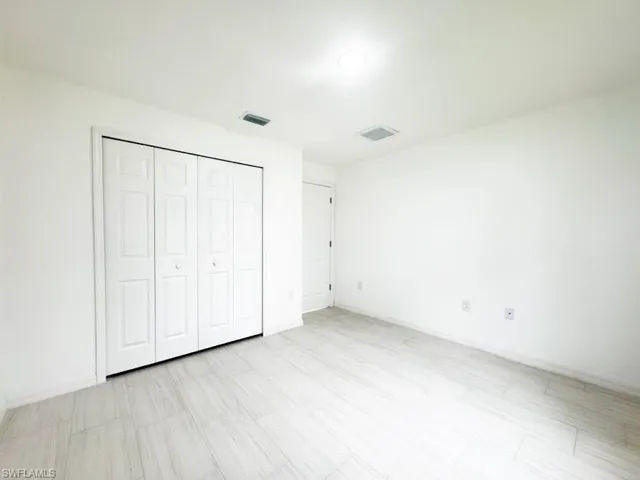 Unfurnished bedroom featuring a closet
