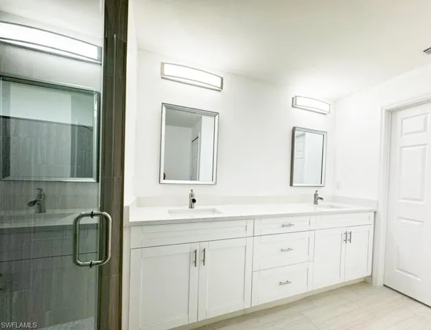 Bathroom with vanity and an enclosed shower