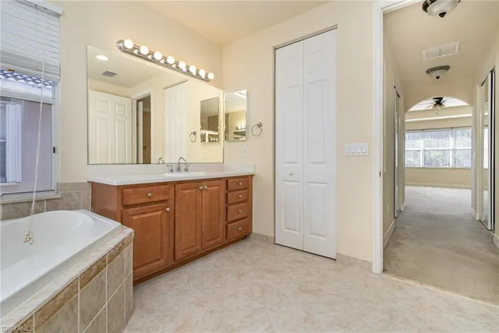 Bathroom featuring a relaxing vinyl tub with beautiful tile finish.